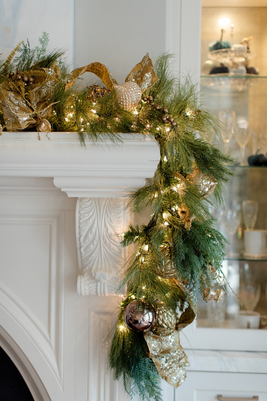 Frontgate premade garland adorns the fireplace.